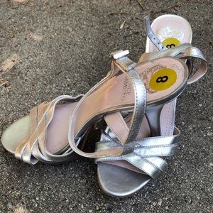 Silver platform high heeled shoes